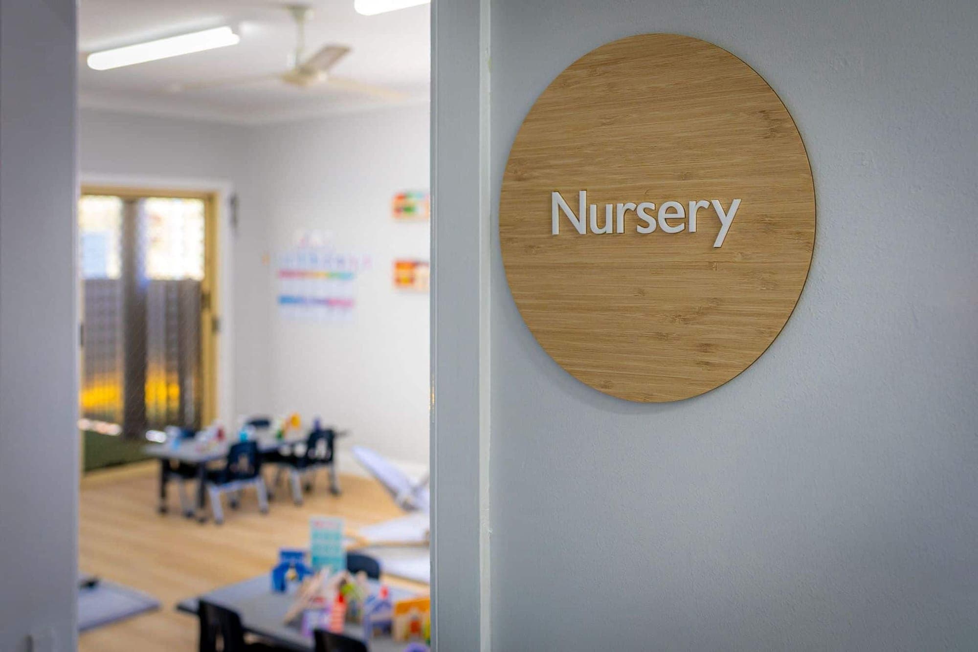 Timber Nursery sign beside the doorway into the nursery room