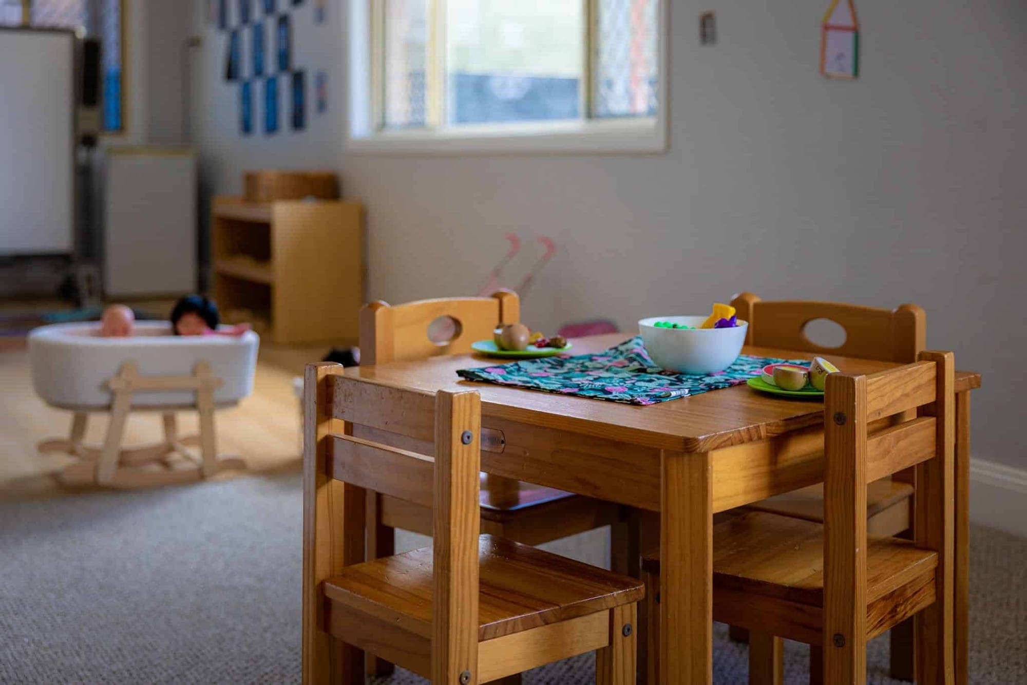 Small timber table and chairs set for a meal in the nursery