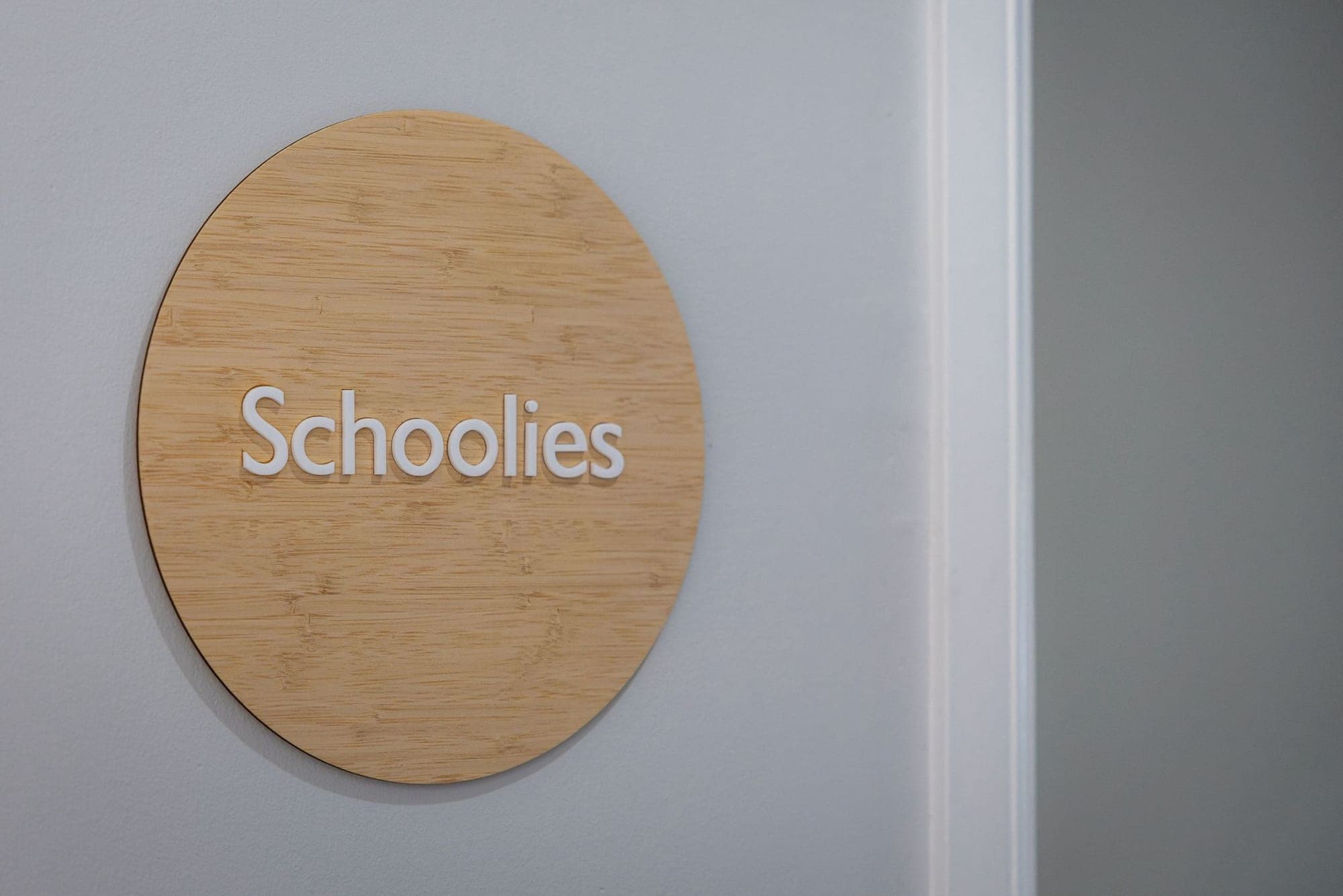 Timber Schoolies sign marking the OSHC room